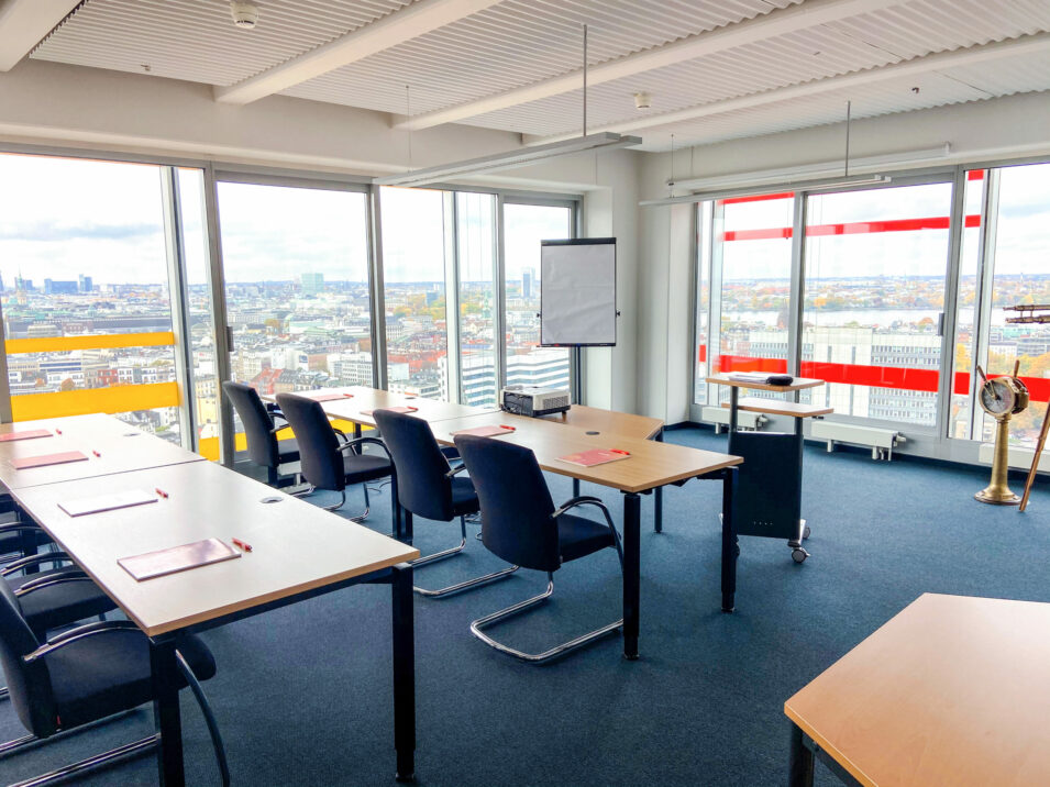 Photo of a training room of the valantic Academy above the roofs of Hamburg.