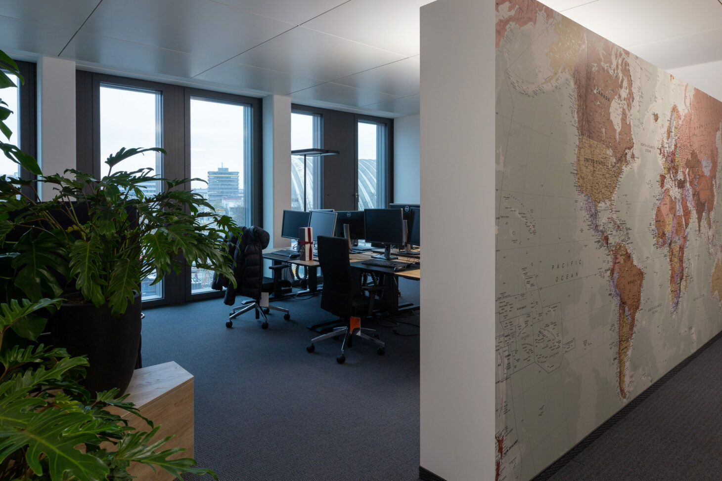 Picture of offices and world map, valantic branch Supply Chain Excellence Munich