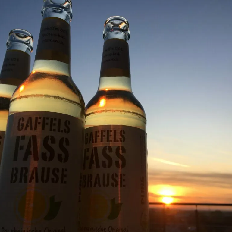 Image of three bottles of Fassbrause before sunset, valantic branch Siegburg