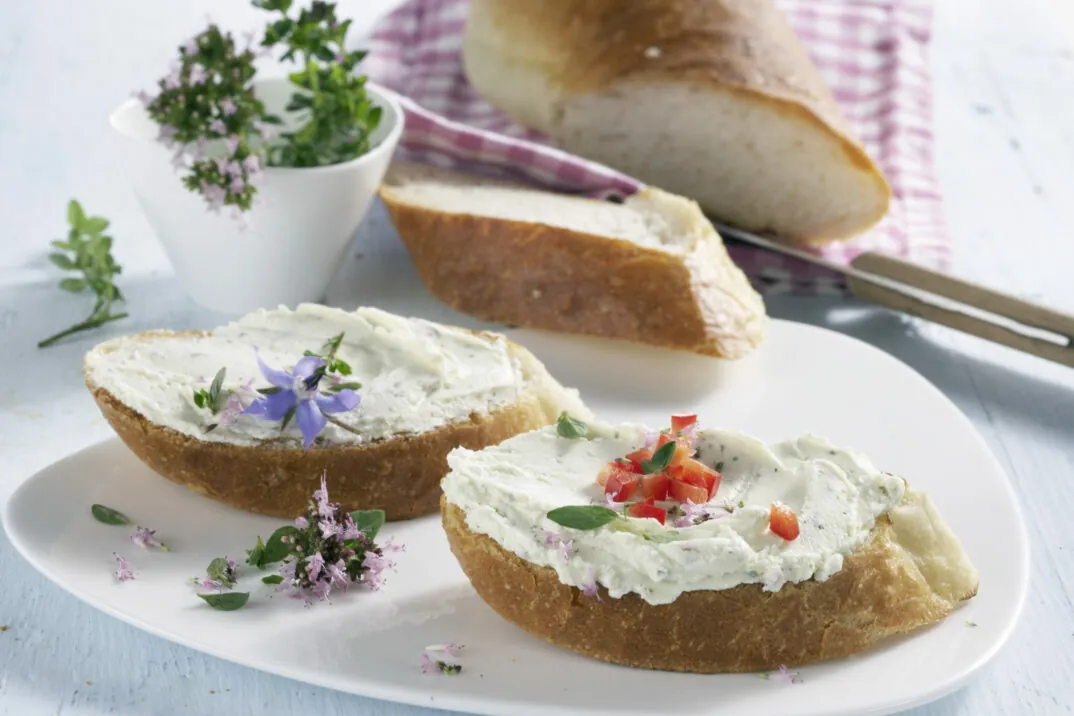 Image of baguette slices with cream cheese, valantic Case Study Hochland migrates to SAP S/4HANA