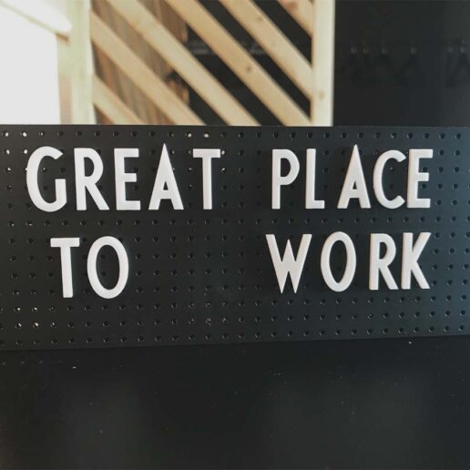 Sign saying Great Place to Work, career at valantic