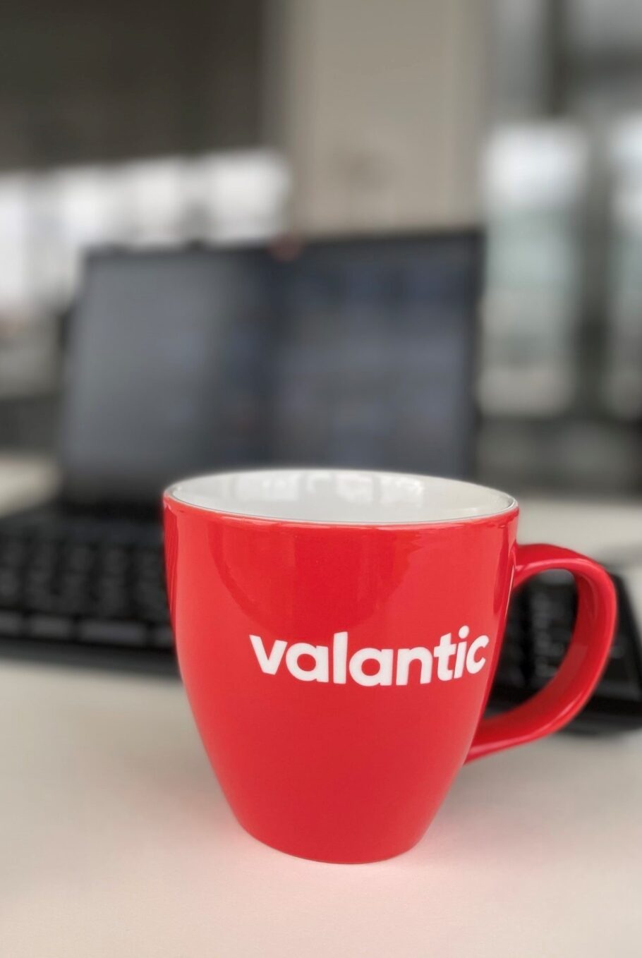 Image of a cup with the valantic logo on it - your partner for digital transformation
