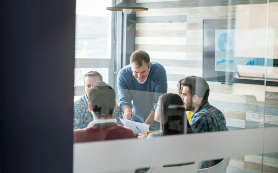 Image of a group of people sitting in a meeting room, SAP consolidation