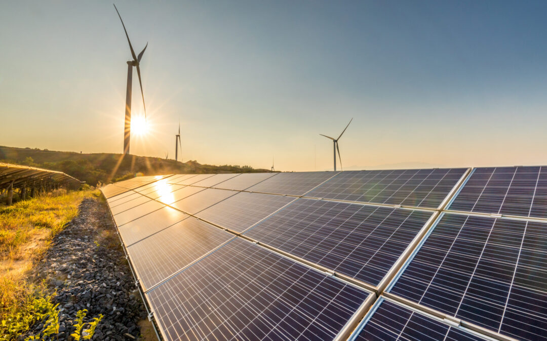 Image of a solar plant and wind turbines in the background; valantic Smart Industries & Industrie 4.0
