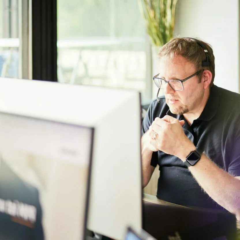 A valantic employee on the phone with a customer.