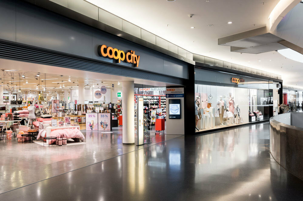 Image of a Coop City location in a shopping mall, SAP Commerce