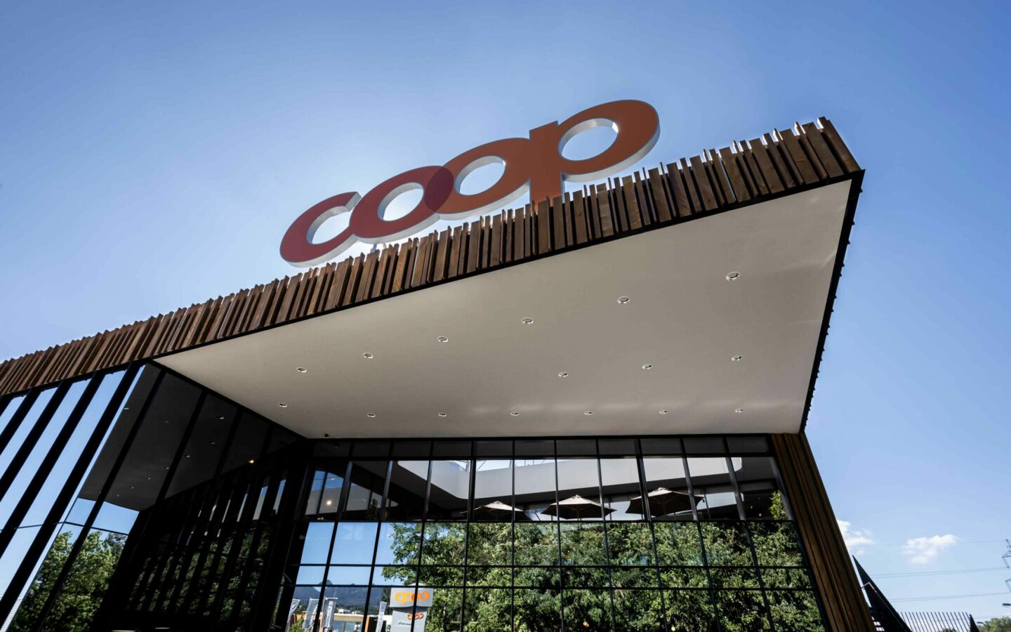 Image with the exterior view of a Coop supermarket, SAP Commerce