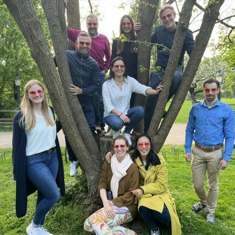 Group picture of valantic employees in the greenery, Management Consulting Career at valantic