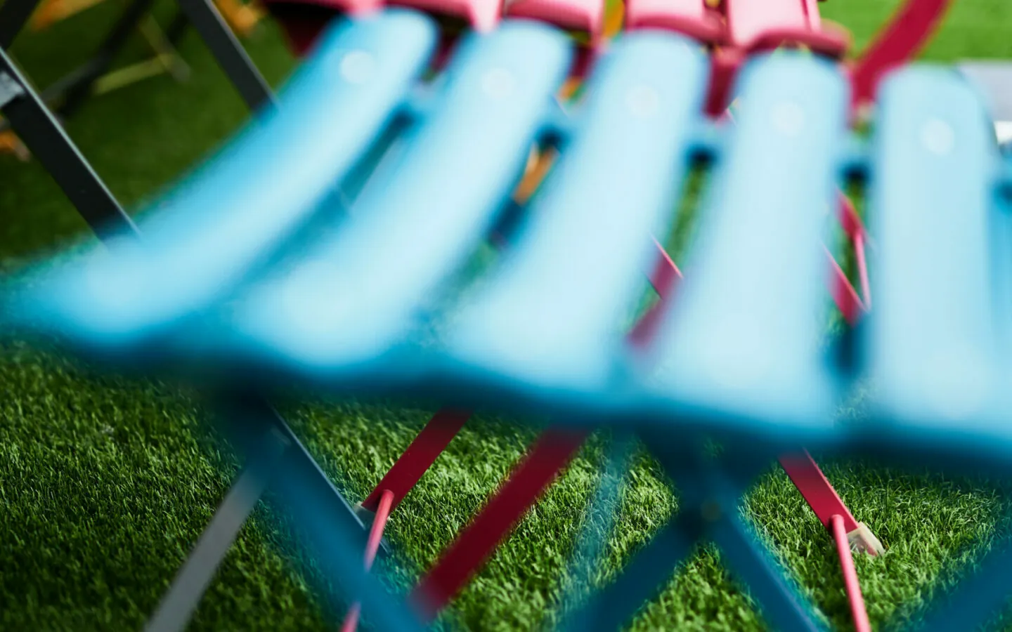 Close up of colorful patio chairs.