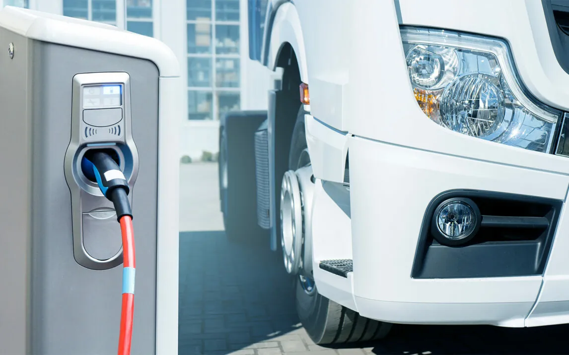 Electric vehicles charging station on a background of a truck