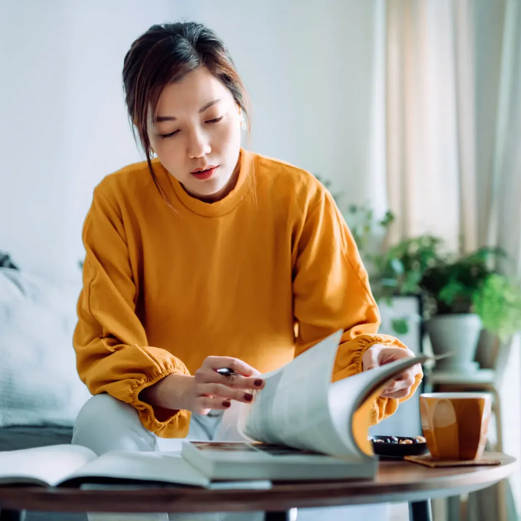 focused-young-woman-reading-book