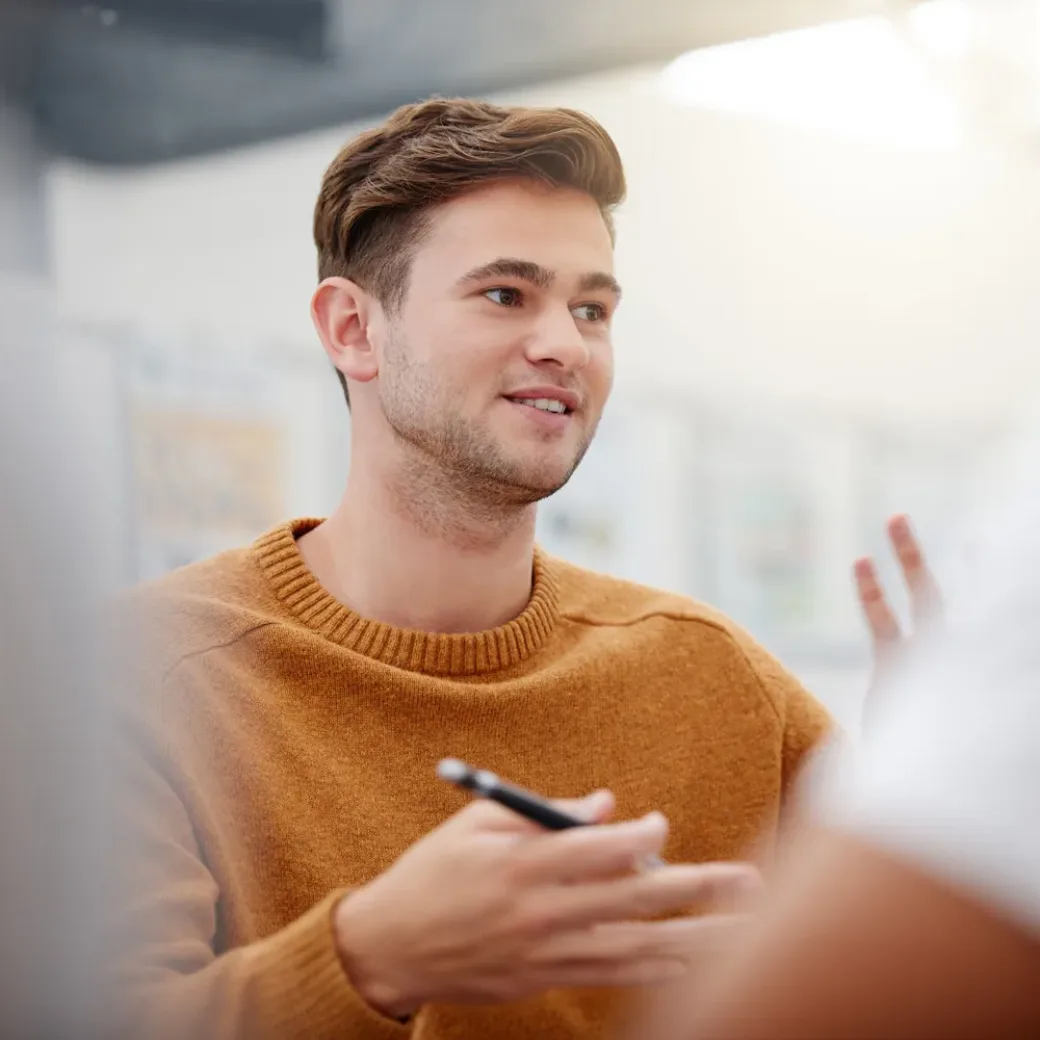 Shot of a mature businessman having a discussion with a colleague in an office