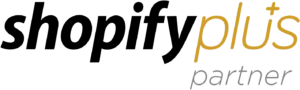 Logo met de tekst "Shopify plus partner" in zwart en goud.