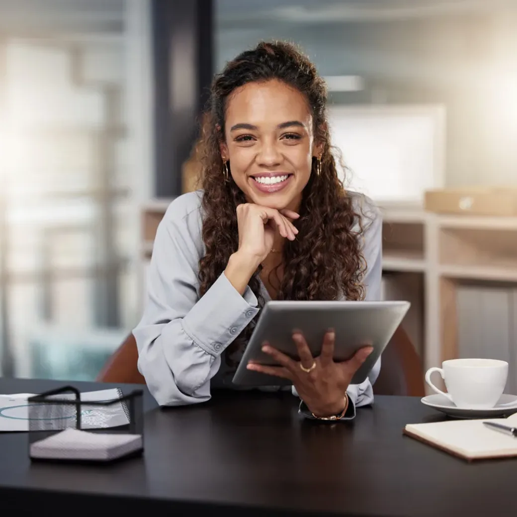 Shot of a young woman using a tablet at work