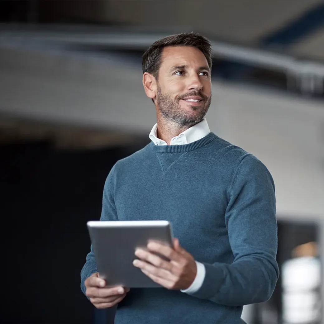 Cropped shot of a mature businessman working on his tablet in the office