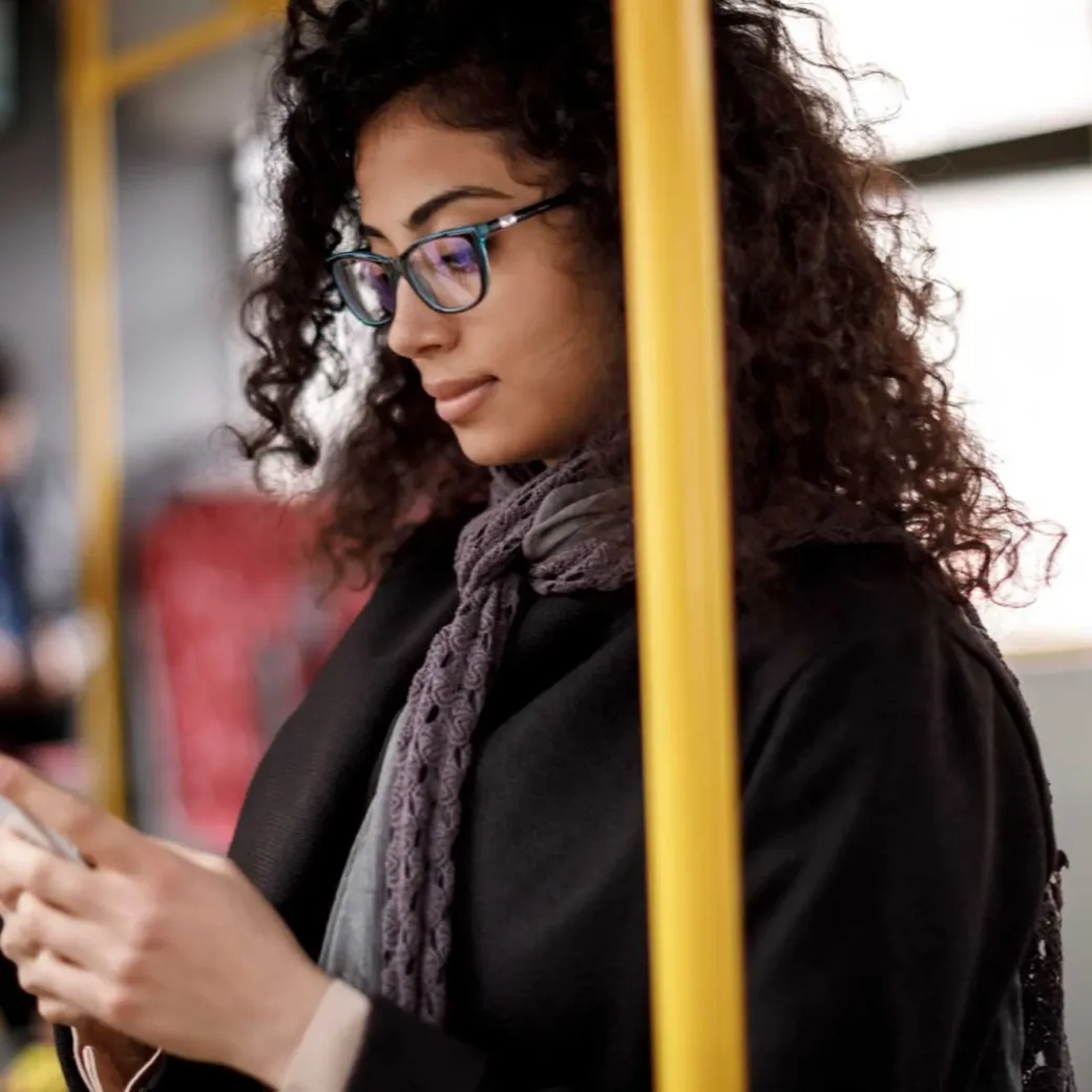 young-woman-traveling-by-bus-and-using-smart-phone